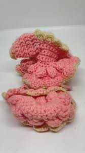 Petite pink crochet mini doll dress and can be used as a bonnet.