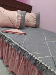 Grey and pink bed sheet and pillow covers