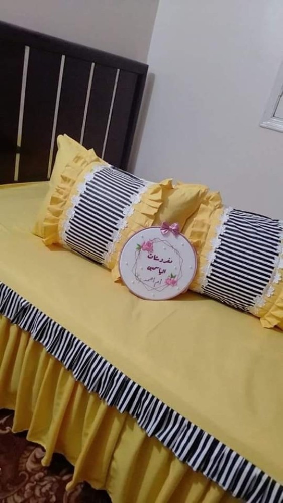 Yellow and grey bed sheet and pillow covers