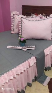 pink and grey bed sheet and pillow covers