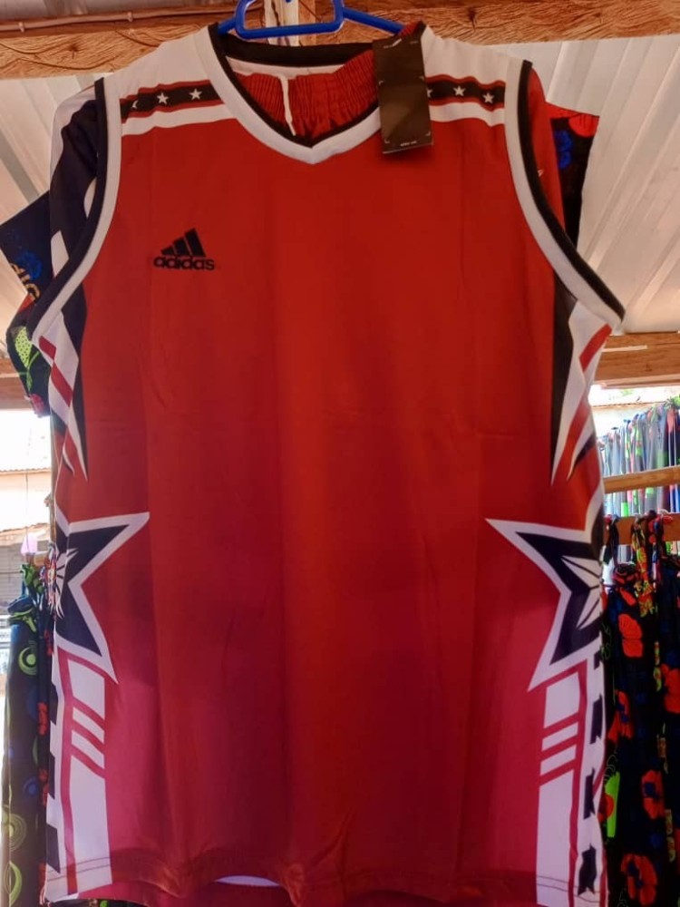 Adidas basketball jersey and short red and black in color.