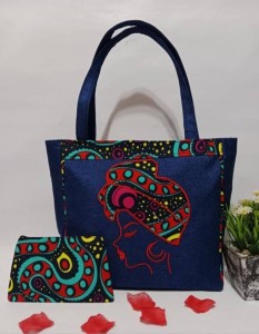 Dark denim African hand Bag with a straps for both hand and shoulder sewed with red thread