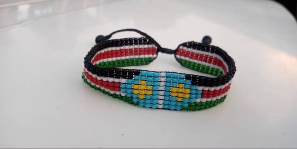 Beaded bracelets with desired name, place or anything designed with South Sudanese flag