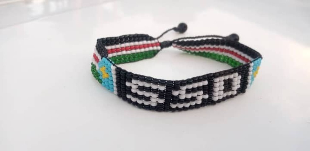 Beaded bracelets with desired name, place or anything designed with South Sudanese flag