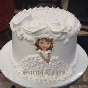 Princess cake with white cream and eatable princess