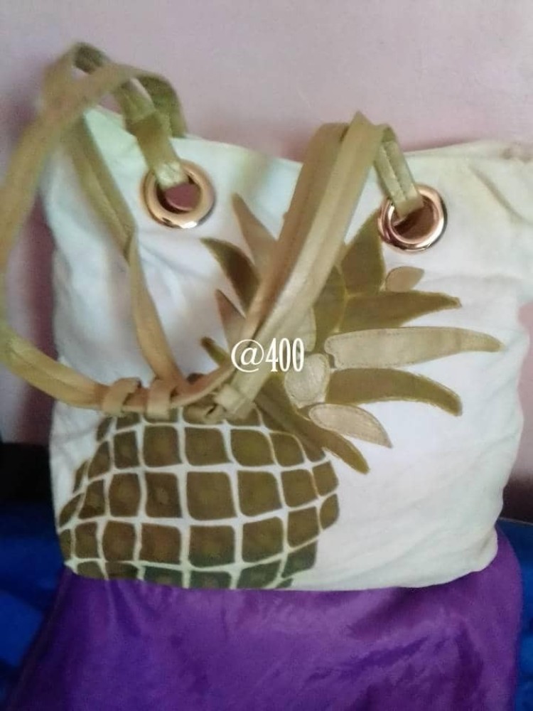 Shoulder and hand bag. white and greenish color.