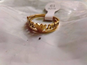 Golden ring designed with a heart and love writing available at different sizes